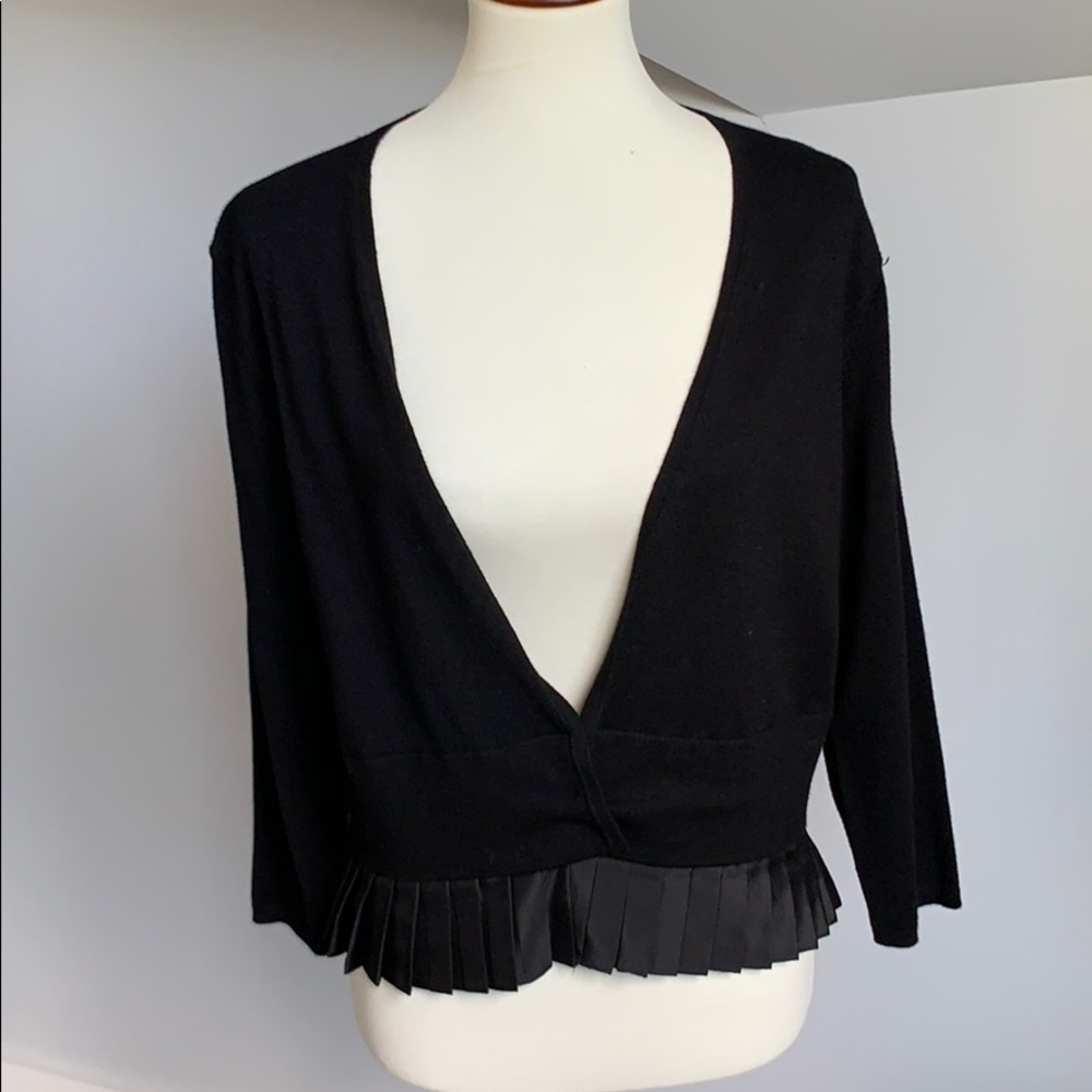 Sleek peplum cardigan sweater